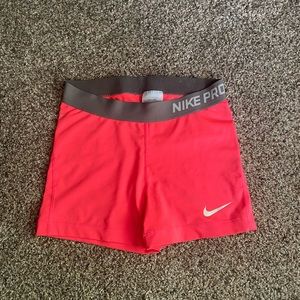 hot pink nike pro shorts